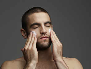How often should men use a face scrub?