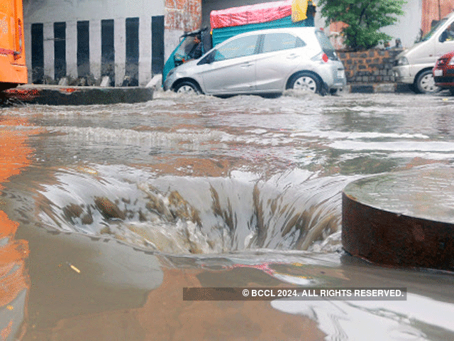 Manhole opened up to clear waterlogging