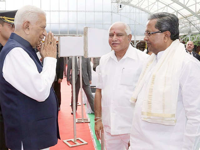 Governor Vajubhai Vala greets chief minister Siddaramaiah