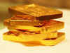 Hot commodities: Gold rises, oil slips on global cues