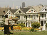 An artist paints the skyline of San Francisco