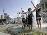 Pupils dance in a fountain