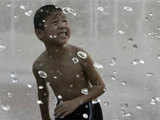 A child cools down during hot weather