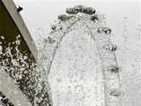 A girl cools off at a water fountain