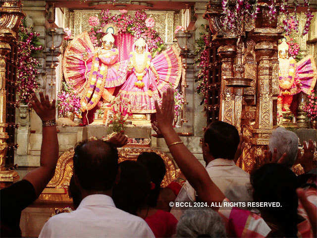 Devotees offer prayers at ISKCON temple