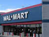 Wal-Mart posts flat 2Q profit; boosts outlook