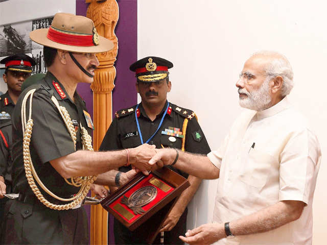 PM Modi shakes hand with Bikram Singh