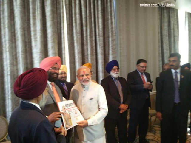 With representatives of Sikh, Gujarati communities