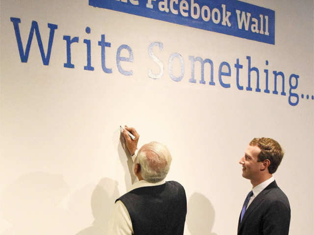 Modi writes his comments on the Face book Wall