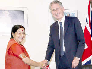 Sushma Swaraj greets Philip Hammond