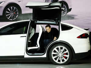 Elon Musk Delivers Teslas First Model X Electric Suvs The