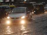 Car drives through flooded road