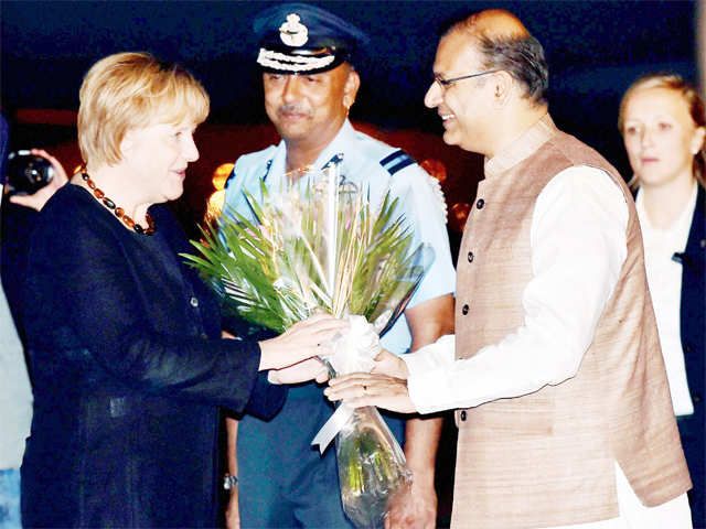 Merkel being received by Jayant Sinha