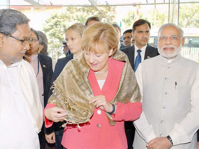 PM Modi with Angela Merkel & Siddaramaiah