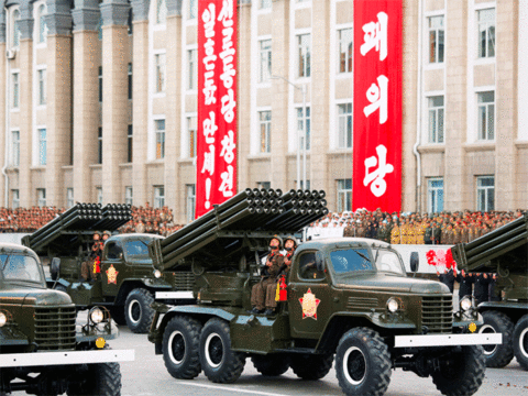 North Korean soldiers parade with their missiles and rockets