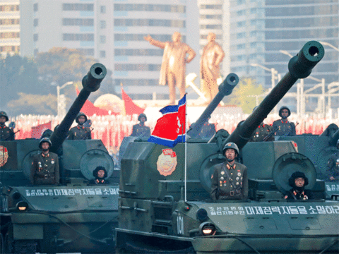 Soldiers in tanks parade in Pyongyang
