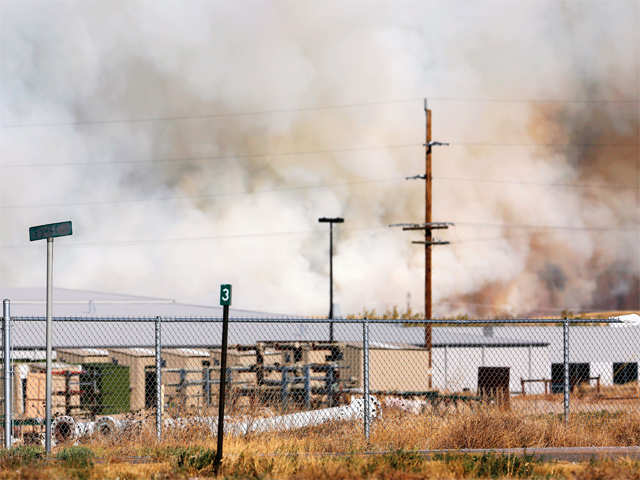 Wildfire behind residential areas