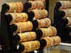Crude oil futures fall, gold prices in red