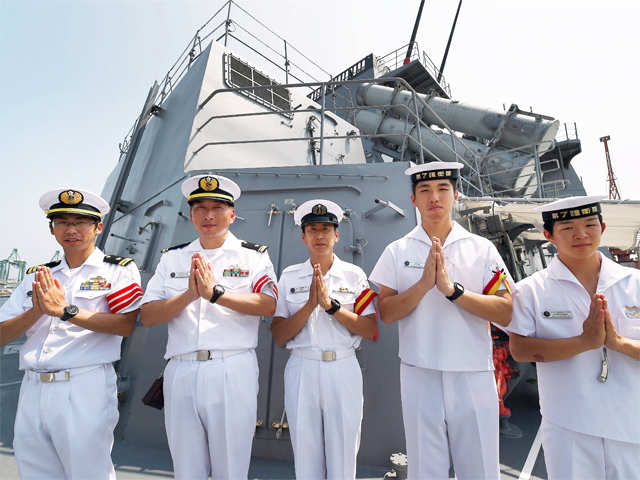 Japanese naval officers greet onlookers