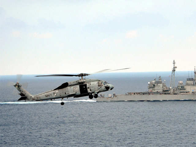 US Navy helicopter approaches to land