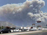 Smoke rises from Station Fire