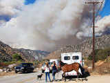 Girls evacuate a horse