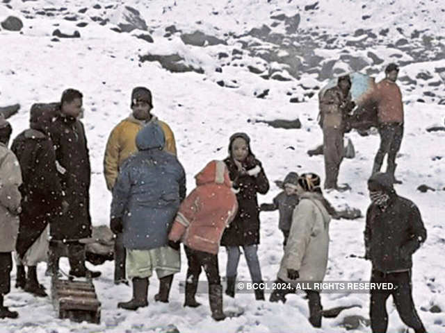 Tourists enjoying the snowfall