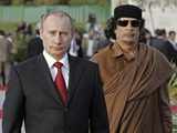 Putin meets Gaddafi