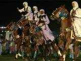 Horsemen perform during ceremony