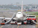 Ground staff, emergency personnel rush with fire brigade