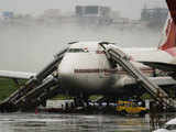 AI's Boeing 747 stands on a tarmac after one of its engines caught fire