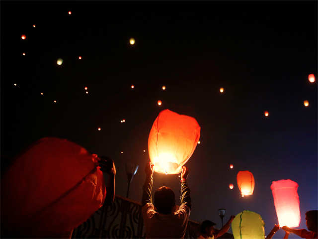 People light up the sky with lanterns