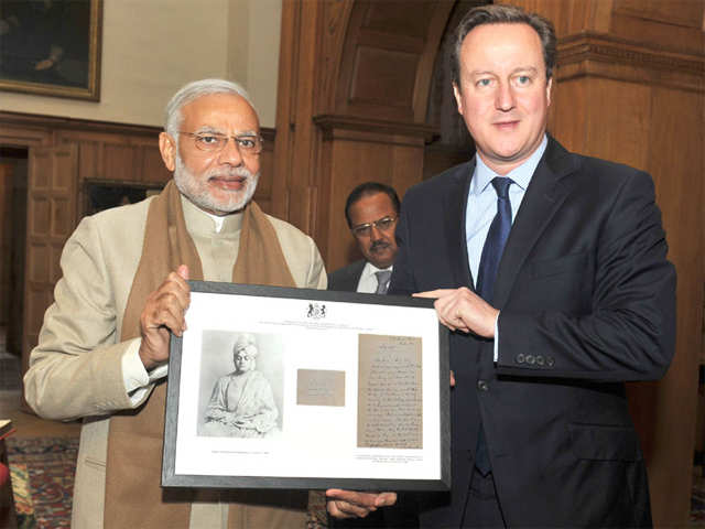 PM Modi presenting gifts to David Cameroon