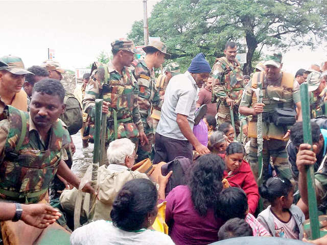 ​Army personnel rescuing flood affected people