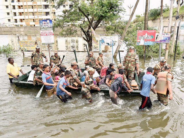 ​Army personnel rescuing people
