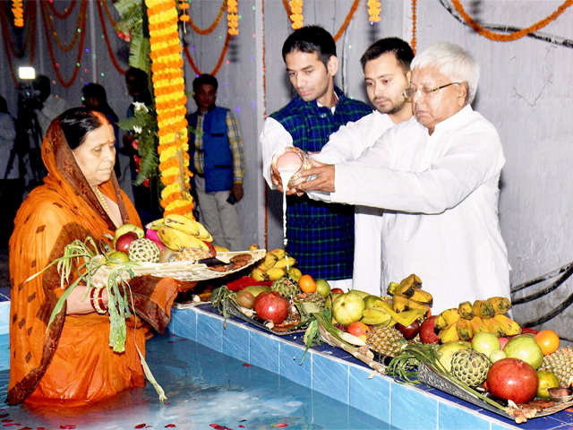 Lalu Prasad with his wife during the last day of Chhath Puja