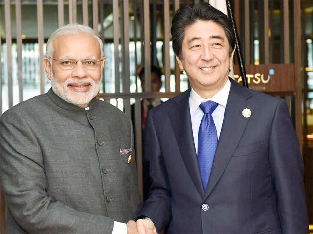 PM Modi shakes hands with his Japanese counterpart