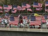 People waves flags to honor 9/11 victims