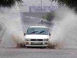 A car drives through water logged road