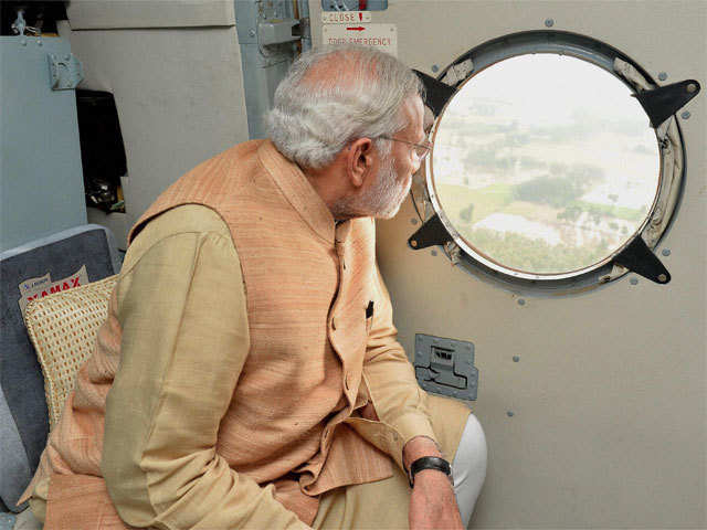 PM Modi conducting an aerial survey