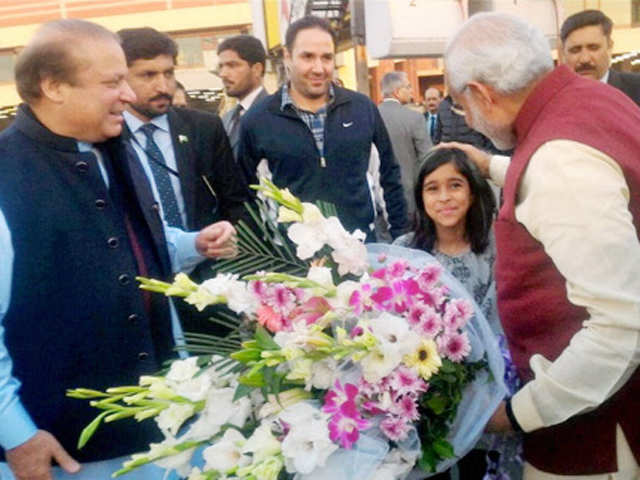 Modi is greeted by a girl on arrival