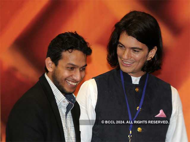 Ritesh Agarwal with Adam Neumann