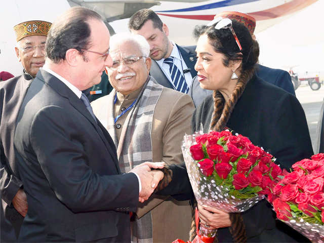Hollande being welcomed by Kirron Kher