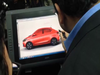 Auto Expo 2016: Cyrus Mistry Designing A Car At The Tata Motors Pavilion