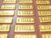 Gold glitters to 5-month high; oil prices edge higher