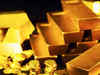 Gold prices dip; crude tumbles in trade