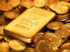 Gold slips on global cues, muted demand