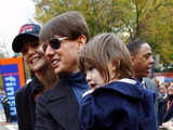 Tom Cruise holding his daughter Suri