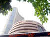 Sensex ends flat in volatile trade; Unitech up 13%