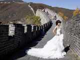 Woman in bridal gown at Great Wall of China